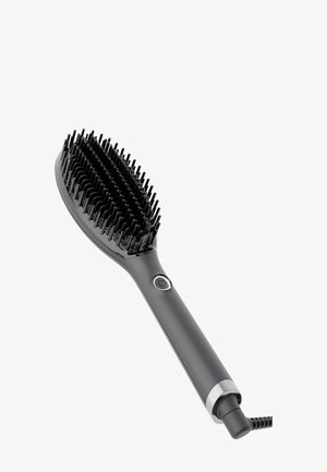Brosse lissante électrique noire avec un bouton d'alimentation sur la poignée et un cordon fixé à la base.