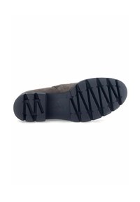 Semelle de chaussure gris foncé avec un motif de grip texturé, comportant des nervures surélevées et le logo "Gabor" en relief. Design léger et flexible.