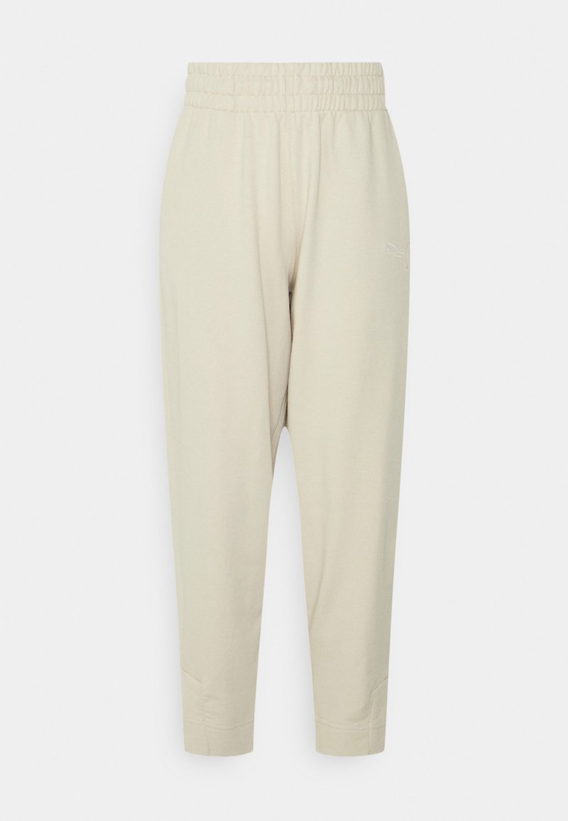 Lys beige, bomuldsblanding joggers med elastisk talje, tapered ben og sideslids detaljer. Har broderet logo på hoften.