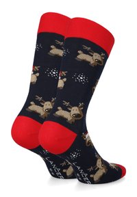 Granatowe skarpetki z wzorem renifera, z czerwonymi mankietami i piętami. Wykonane z miękkiego materiału, idealne do noszenia na co dzień w zimie.