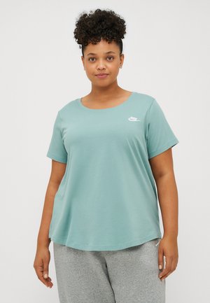 Light teal cotton t-shirt with a round neck and short sleeves. Features a small white Nike logo on the left side. Soft texture, relaxed fit.