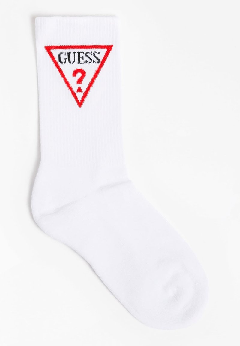 Chaussette en coton blanc présentant un graphique triangulaire rouge avec le mot "GUESS" et un point d'interrogation au centre. Texture côtelée en haut.