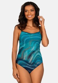 Jednoczęściowy strój kąpielowy w turkusowym i niebieskim kolorze z falistymi wzorami, regulowanymi cienkimi ramiączkami i dopasowanym krojem.