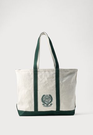 Hvid lærreds-tote taske med mørkegrønne håndtag og bund, med en frontlomme med Polo Ralph Lauren Wimbledon-logo i grøn.