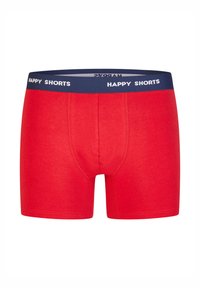 Boxer corto rojo de algodón con ajuste ceñido. Cuenta con una cintura azul marino con texto blanco "HAPPY SHORTS". Textura suave con costuras planas.
