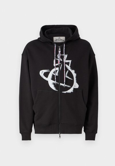 Black zip-up hoodie made of cotton, featuring a large white graphic design on the front, drawstrings with red and black accents, and front pockets.
