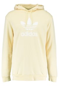 Světle žlutá mikina s kapucí vyrobená z měkké látky, na přední straně s bílým logem Adidas a designem třech pruhů. Kapuce s nastavitelným stahováním.