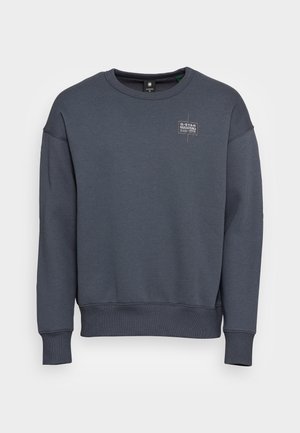 Donkergrijze sweatshirt van een katoenmix, met een ronde halslijn, lange mouwen, ribbelboorden en een klein logo-embleem op de borst.