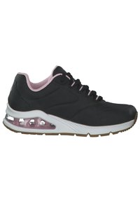 Zapatilla deportiva negra con acentos rosas, superficie lisa, detalles perforados, suela acolchada y una unidad de aire visible en el talón.