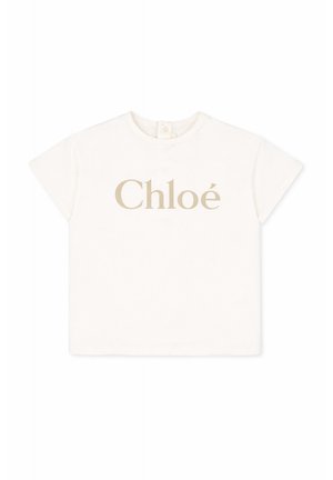 Maglietta bianca a maniche corte per bambino piccolo con logo "Chloé" beige centrato sul davanti e chiusura con bottoni sulla nuca.