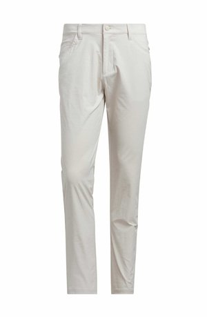 Slim-fit off-white byxor med framknäppning, bältesloopar och sidofickor, utställda mot en vit bakgrund.