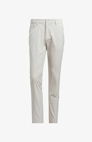Kape slim-fit off-white, yang memiliki kancing depan, loop sabuk, dan saku samping, ditampilkan di latar belakang putih.