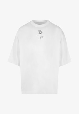 White oversized T-shirt made of cotton, featuring a delicate black line drawing of a rose on the chest area. Short sleeves, round neckline.