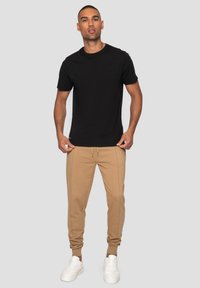 Threadbare JOGGER THBMICKEY - Trainingsbroek - stone