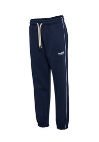 Marinblåa sweatpants med elastiskt midjeband och dragsko, med vita sidränder och logotyp. Mjuk tyg, avsmalnande anklar.