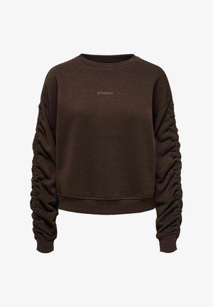 Sweat-shirt à manches longues marron foncé avec encolure ronde, manches froncées et le texte "STUDIO" centré sur la poitrine.