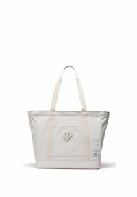 Sac fourre-tout en toile blanc cassé avec double bandoulière, poche avant, patch en forme de losange et petite étiquette de marque en bas à droite.