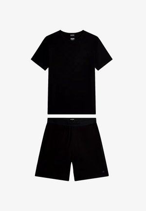 T-shirt noir à manches courtes et short noir assorti, tous deux posés à plat, avec des étiquettes de la marque G-Star sur le col et la taille.