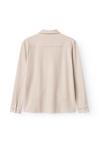 Beezik pikkade varrukatega särk, millel on tekstureeritud kangas, klassikaline krae ja nööpidega mansetid. Omab sirget seljaõmblust ja lõdva istuvust.