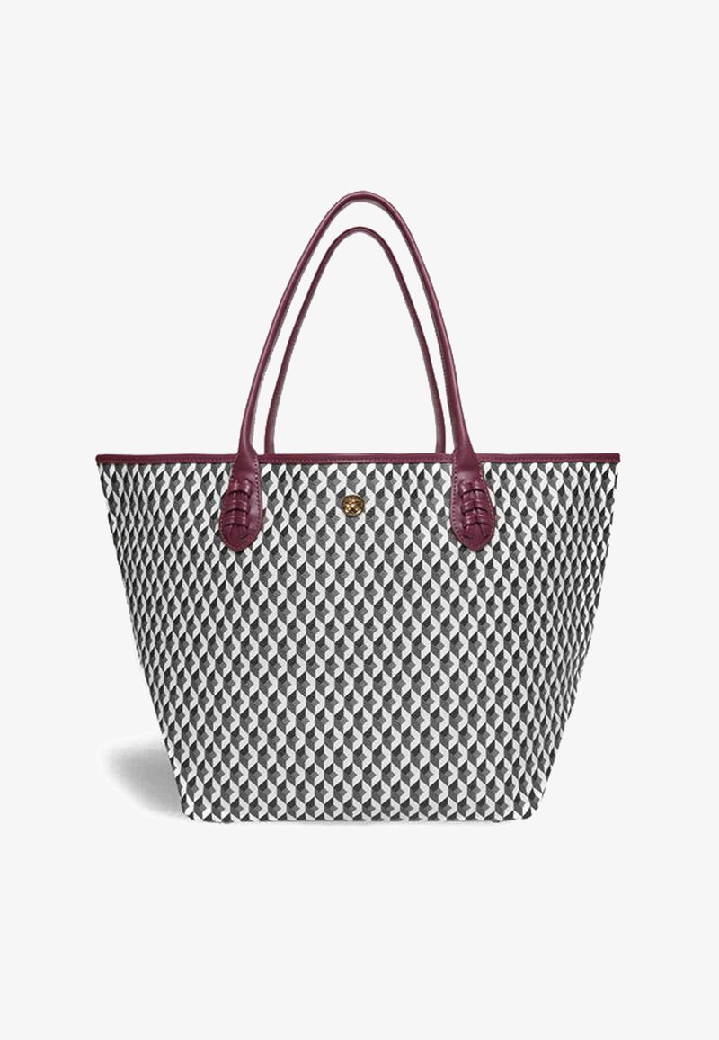 Tote bag featuring a geometric pattern in black and white, with burgundy leather handles and accents, made of durable woven material.