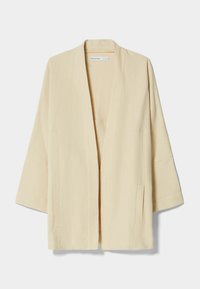 Beige öppna fronten texturerad jacka med breda ärmar och två framfickor med slits, märkt Bershka.