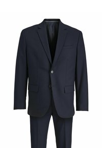 Tumesinine ülikonna jakk ja püksid, valmistatud siledast kangast. Märkimisväärsed omadused: lõikepoolsed kraed, kaks esikotti, ühe nupuga kinnitamine.