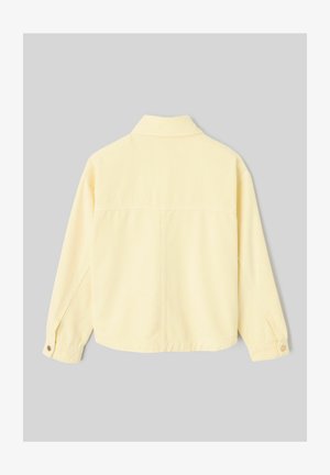 Veste jaune pâle à manches longues avec col, poignets boutonnés et couture visible courant verticalement au centre du dos.