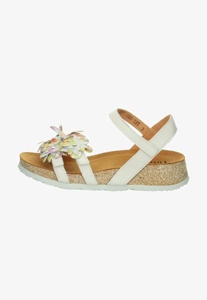 Weiße Sandale mit floralen Verzierungen, ausgestattet mit einer Korkstruktur-Sohle, einem verstellbaren Riemen und einem gepolsterten Fußbett für Komfort.