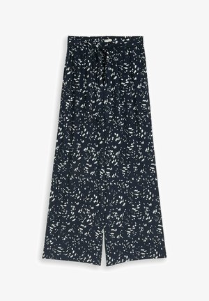 Navy wide-leg pants with white scattered abstract spots and a front tied belt at the waist.