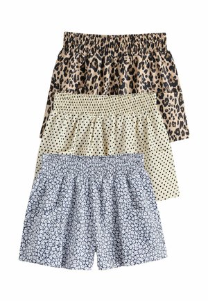 Three pairs of elastic waist shorts stacked, featuring leopard print, black polka dots on beige, and white floral pattern on blue.