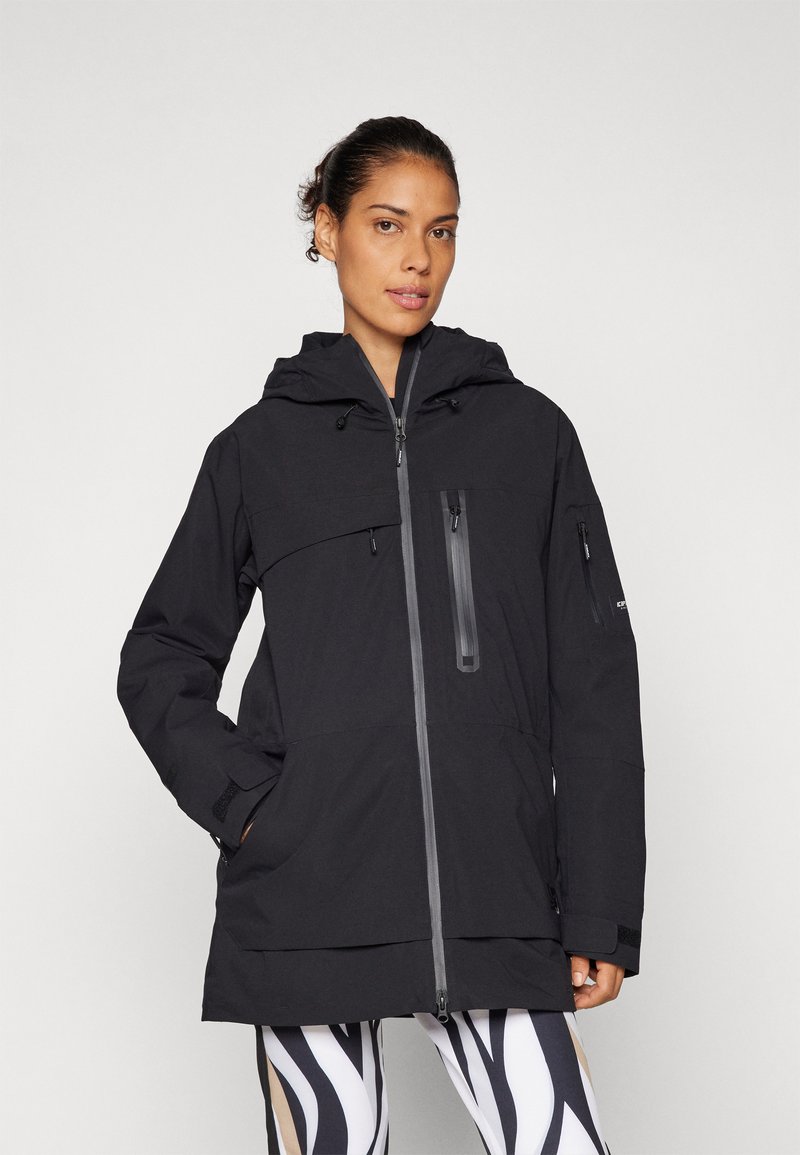 Black waterproof jacket with a hood, front zipper, chest and side pockets, elastic cuffs, and a tunic length. Smooth, matte texture.