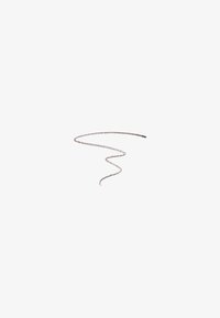 Crayon marron sur fond blanc avec une légère ligne en zigzag tracée depuis sa pointe, s'estompant en s'étendant vers le bas.
