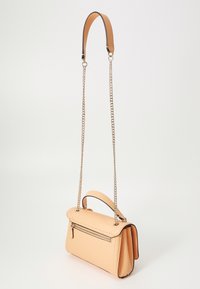 Peach-colored leather handbag with a structured design, featuring a top handle, chain strap, and a zippered pocket on the front.