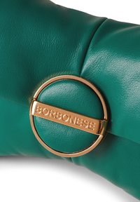 Teal leather handbag with a smooth texture, featuring a gold circular accent engraved with "BORBONESE" at the center.