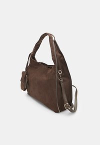 Brown suede handbag with a slouchy design, silver zipper, and detachable shoulder strap. Features a small side pocket with zipper.