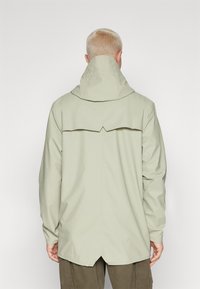 Rains JACKET UNISEX - Parka - earth