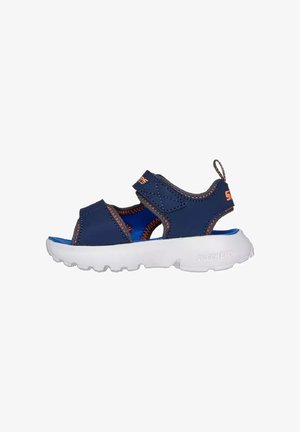 Sandalias azules con un diseño texturizado, correas ajustables y una suela de goma blanca. Presentan costuras naranjas en contraste y un acento de logo.