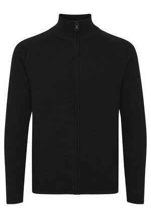 Črna zip-up jopica z visokim ovratnikom, ki ima rebrasto teksturo, dolge rokave in raven kroj za oprijet silhueto.