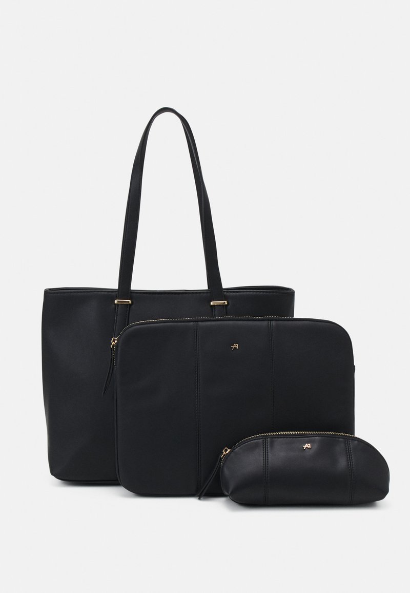 Sac fourre-tout noir avec longues poignées et compartiment zippé ; comprend une pochette assortie et une housse pour ordinateur portable ; texture lisse, design minimaliste.