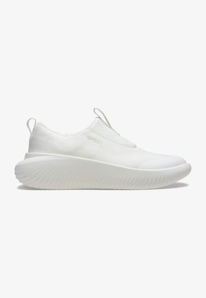 White slip-on shoe with textured fabric upper and rounded toe. Features a thick, ridged sole and pull tabs at the heel for easy wear.