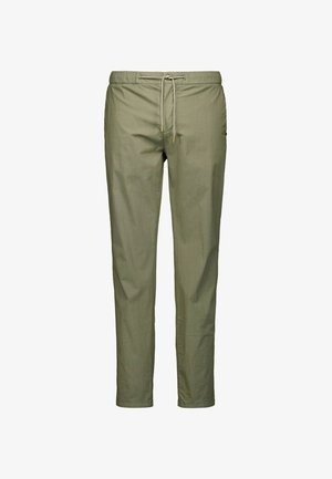 Lichtgroene broek van zacht materiaal, met een elastische tailleband, trekkoordsluiting en een slim, recht model. Geen zichtbare zakken.