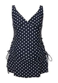 Maillot de bain bleu marine à pois avec des liens latéraux réglables, un corsage froncé et une jupe évasée. Le tissu a une texture lisse et brillante.