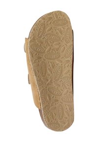 Semelle de sandale tan en caoutchouc texturé présentant des motifs ovales et le nom de marque "PLAKTON" embouti sur toute sa surface. Les bords sont lisses et arrondis.
