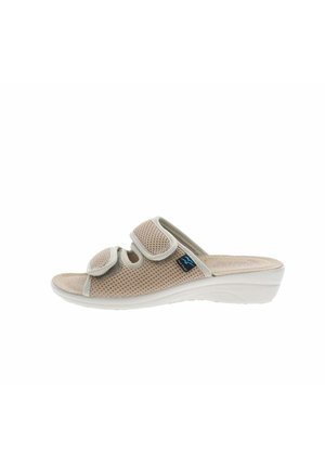Sandalino beige con punta aperta, due cinturini in velcro regolabili e suola a zeppa per comfort e sostegno.