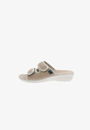Sandalia beige de dedo abierto con dos correas de velcro ajustables y suela de cuña para comodidad y soporte.
