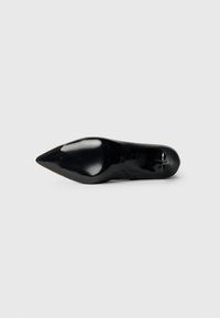Black pointed-toe stiletto shoe with a smooth finish and subtle ridges on the sole. Sleek design with a tapered silhouette.