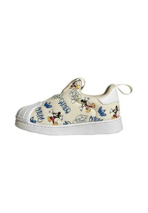 Zapatilla infantil sin cordones con suela blanca, tejido beige, con múltiples estampados de Mickey Mouse y estilo graffiti azul.