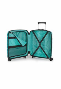Valigia con interno turchese, tasche in rete e cinghie per fissare gli oggetti. L'esterno presenta un design con motivo e maniglia retrattile.