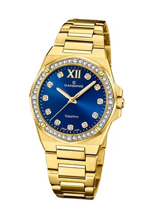 Goldfarbene Uhr mit einem achteckigen Design, blauem Ziffernblatt, Kristallmarkierungen, Diamantakzenten und einem verlinkten Metallarmband. Mit Schweizer Handwerkskunst.