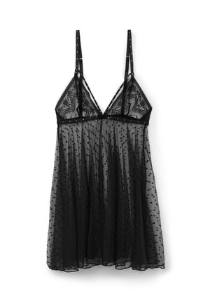 Zwarte transparante lingeriejurk met verstelbare dunne bandjes, kanten cups en een polkadotpatroon op tule stof.